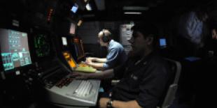 us_navy_060519-n-2959l-004_cryptologic_technicians_monitor_electronic_emissions_in_the_electronic_warfare_module_aboard_the_nimitz-class_aircraft_carrier_uss_ronald_reagan_cvn_76.jpg